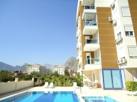 Квартира  в современном комплексе  Анталии с бассейном и чудесным видом на горы
